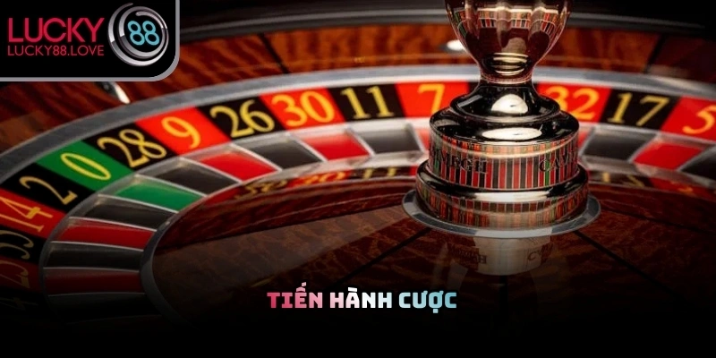 Người chơi đang thực hiện thao tác đặt chip cược vào bảng số trên bàn